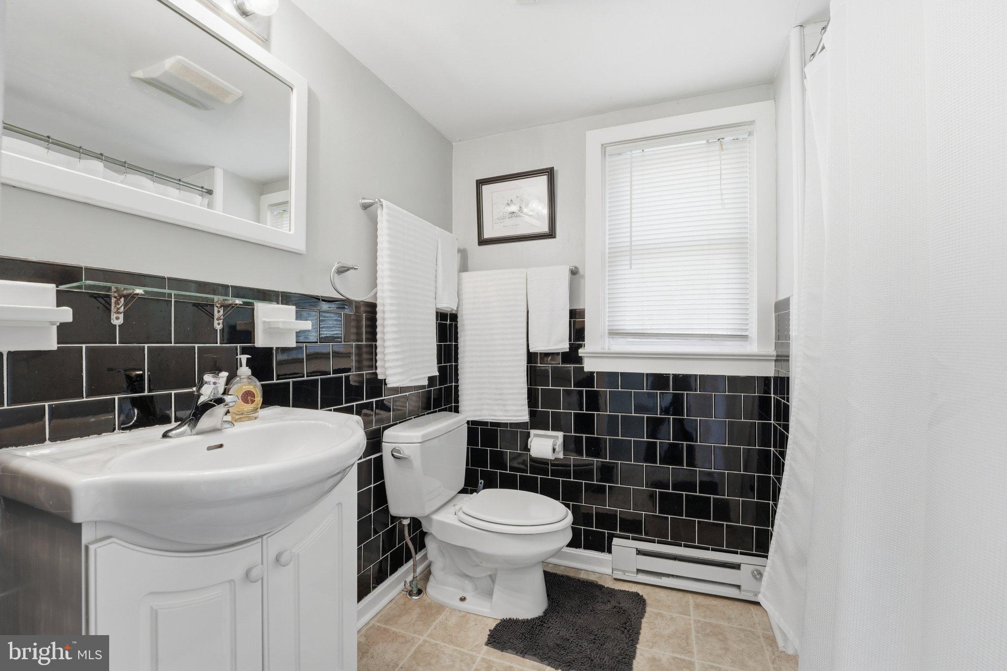 24 Sundown Lane Boston, VA 22713 - Photo 29 of 48 Sleek modern bathroom with elegant tiles.