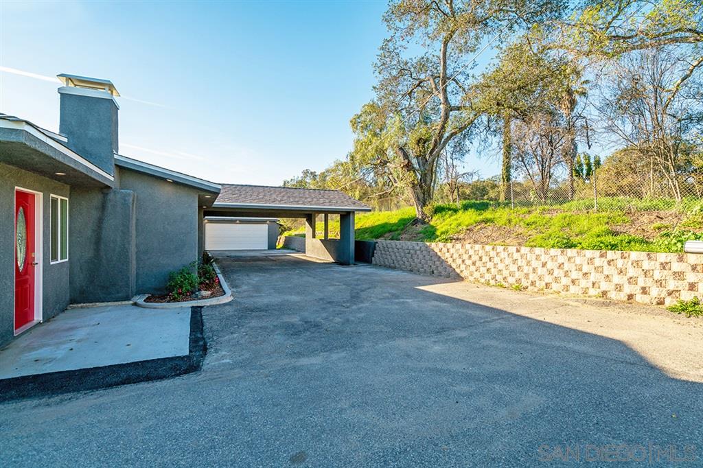 516 Live Oak Park Road South Fallbrook, CA 92028 - Photo 22 of 25 Enjoy a two-car garage, plus a carport for additional covered parking!