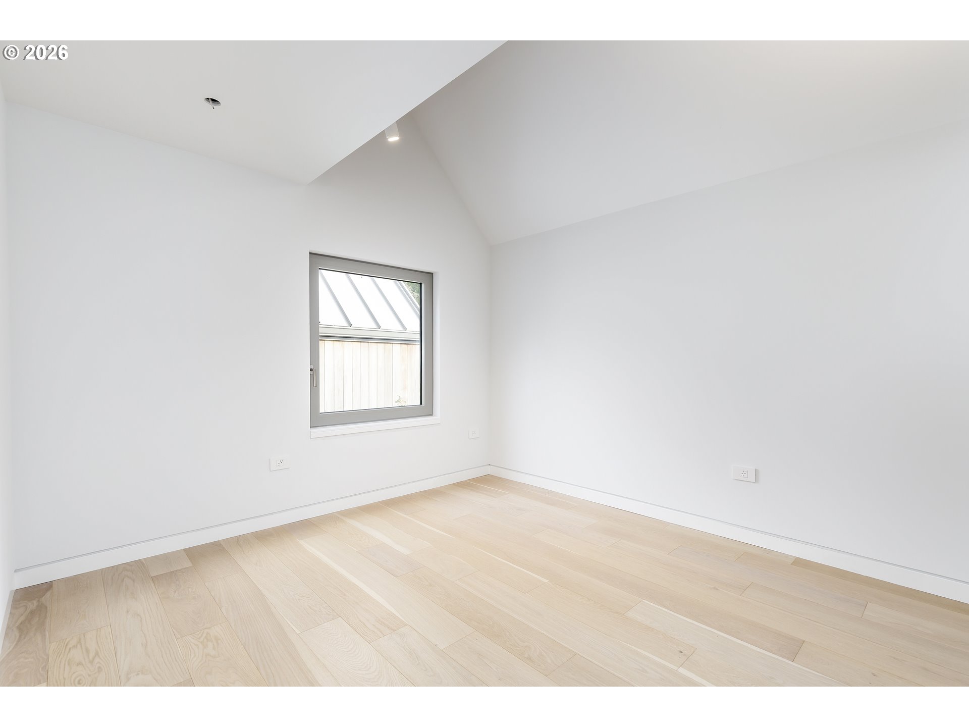 948 South Palatine Hill Road Portland, OR 97219 - Photo 44 of 45 an empty room with wooden floor and windows