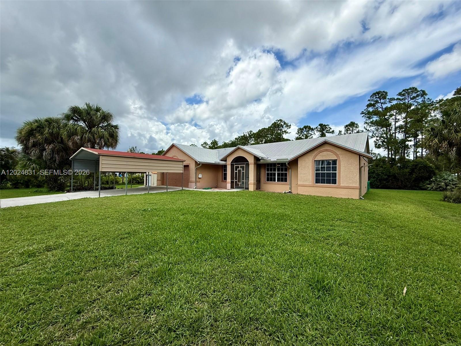 15819 76th Road North Loxahatchee, FL 33470 - Photo 5 of 45 a view of a house with a yard