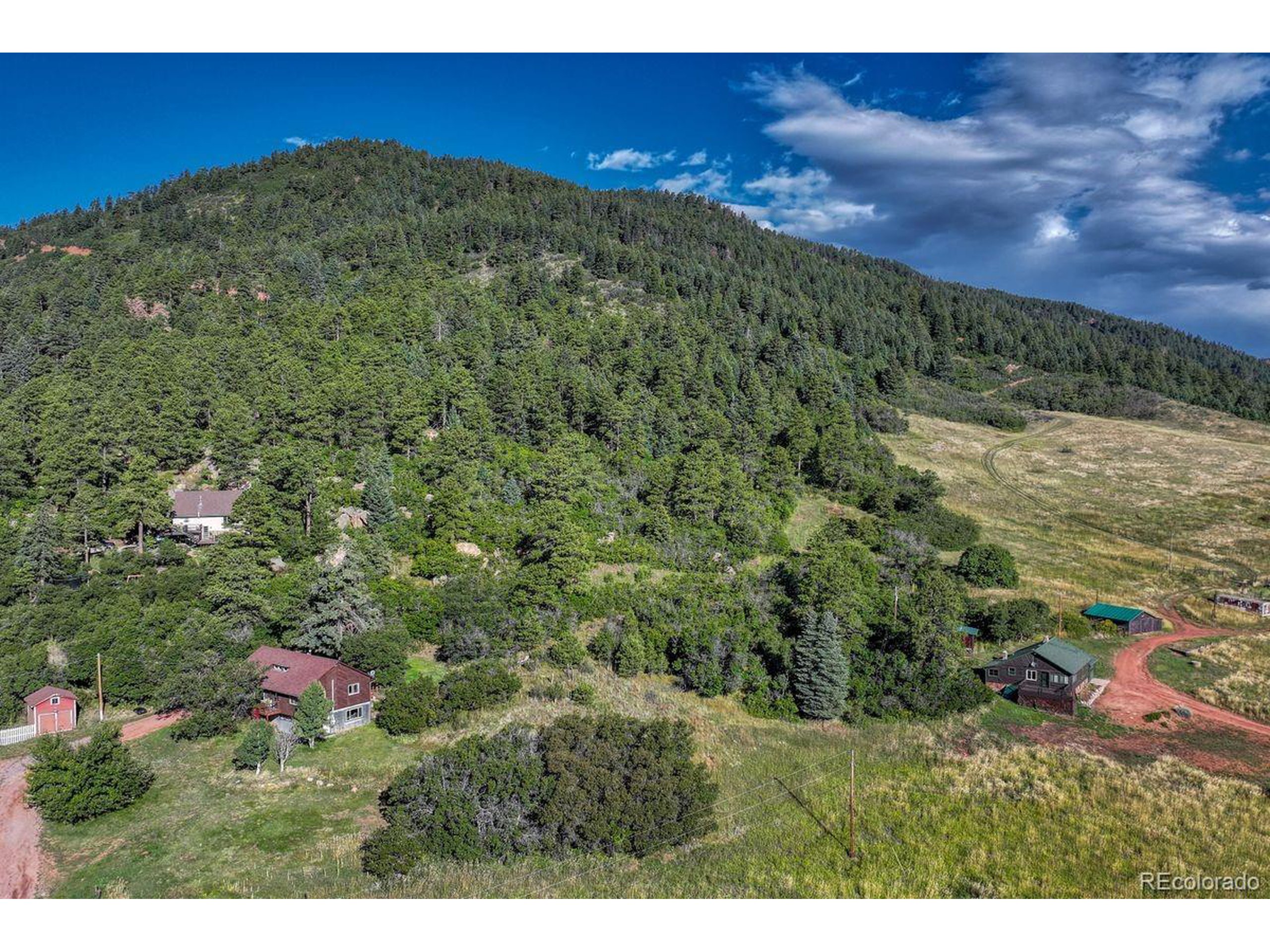 0 Columbine Road Palmer Lake, CO 80133 - Photo 34 of 37 a view of a lush green field