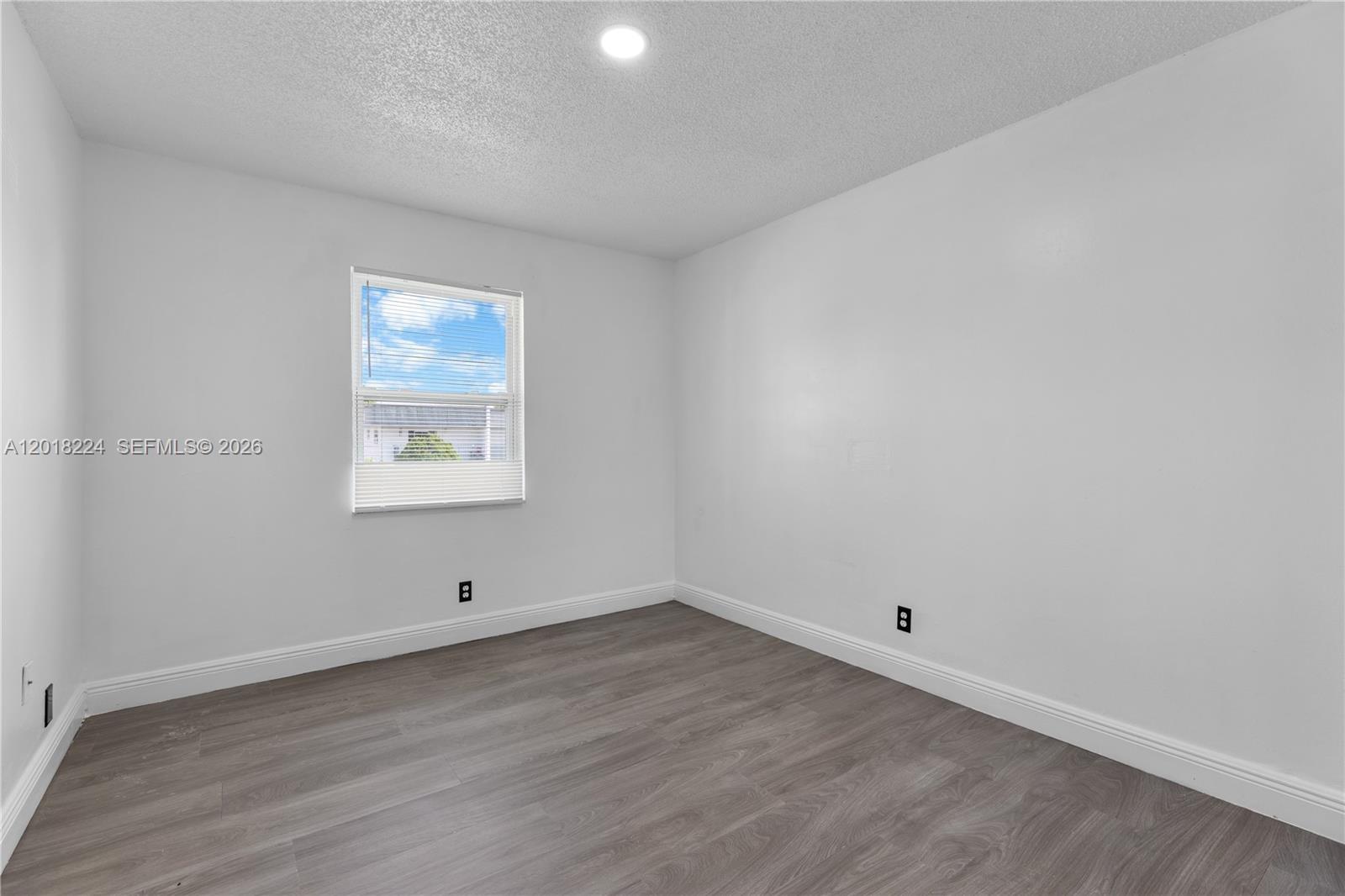 7958 Southwest 6th Street Pompano Beach, FL 33068 - Photo 27 of 57 an empty room with a workspace