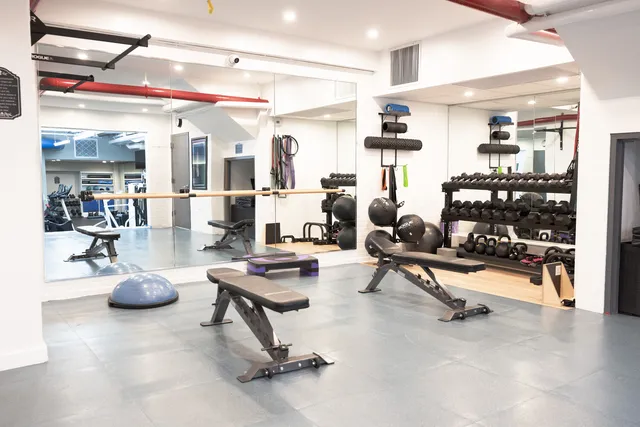 a living room with furniture and white walls