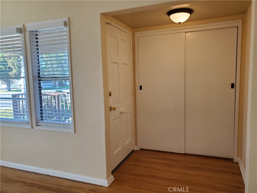 544 Laurel Avenue Brea, CA 92821 - Photo 2 of 15 a view of an empty room with wooden floor and a window