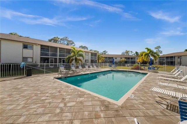 a view of a swimming pool with a lounge chairs