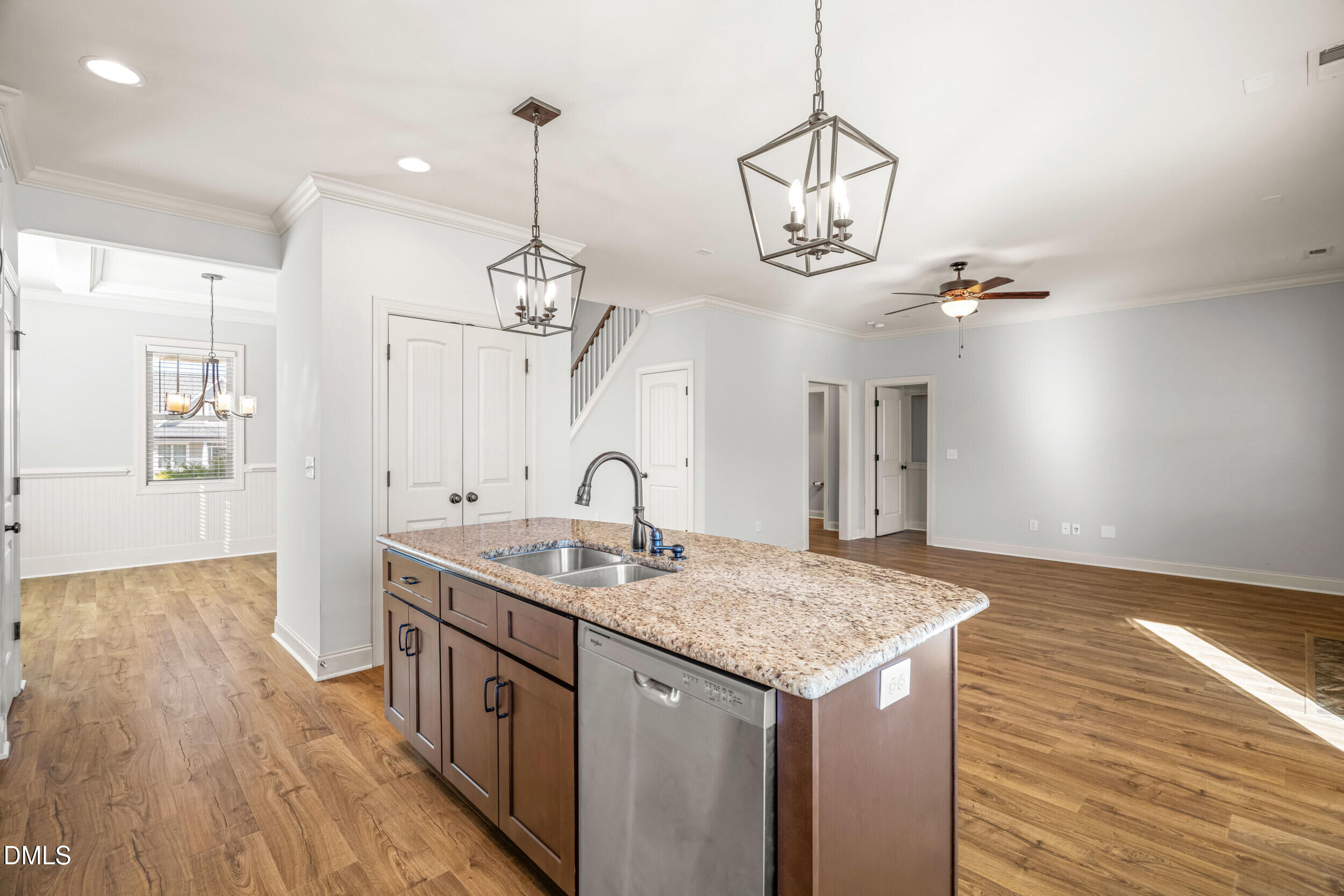 86 Sharpstone Lane Clayton, NC 27527 - Photo 10 of 36 a kitchen with stainless steel appliances granite countertop a sink dishwasher a refrigerator and wooden floor