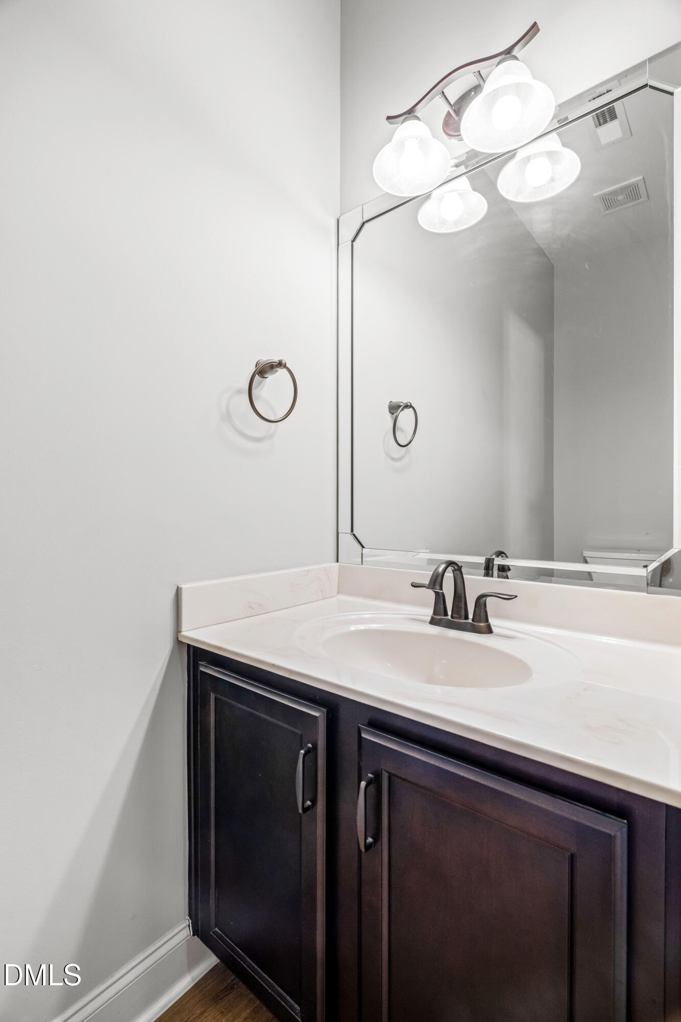 86 Sharpstone Lane Clayton, NC 27527 - Photo 17 of 36 a bathroom with a sink and a mirror