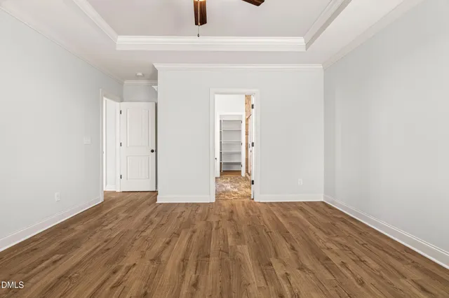 a view of staircase with railing and a chandelier