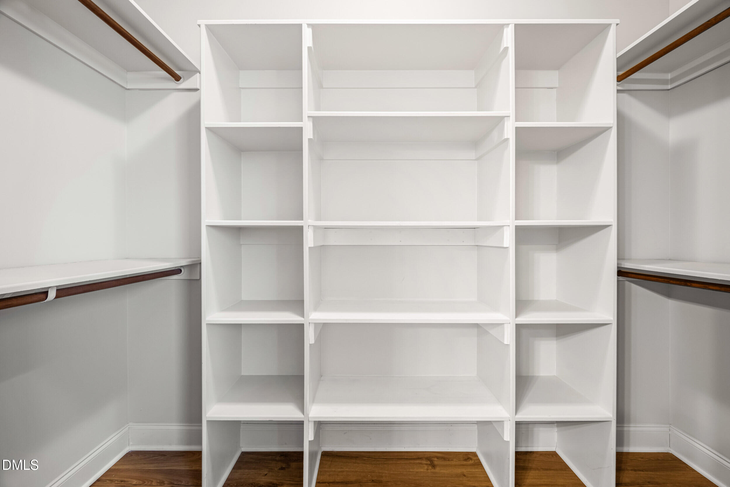 86 Sharpstone Lane Clayton, NC 27527 - Photo 22 of 36 a view of walk in closet with empty racks