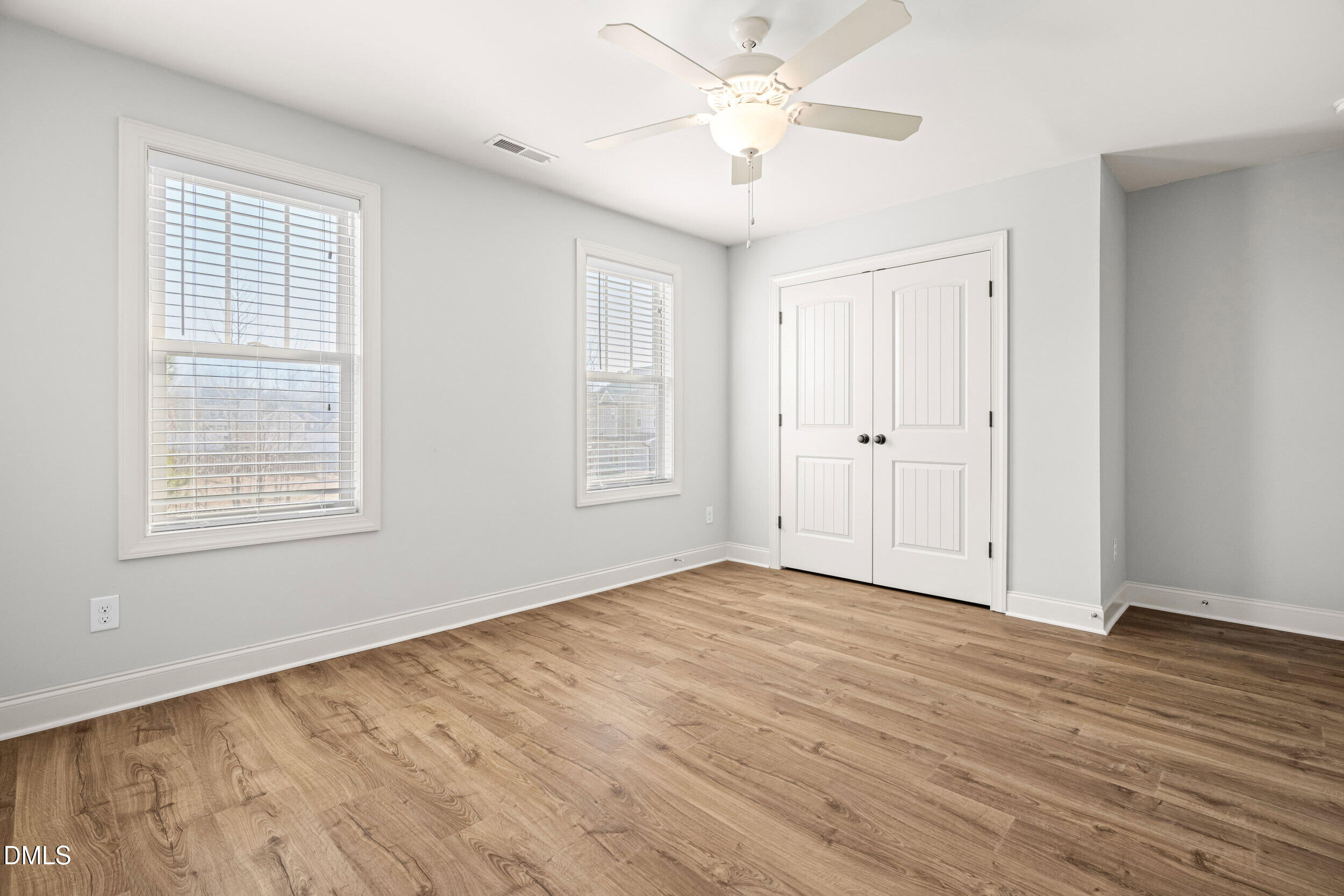 86 Sharpstone Lane Clayton, NC 27527 - Photo 25 of 36 a view of an empty room with wooden floor and a window
