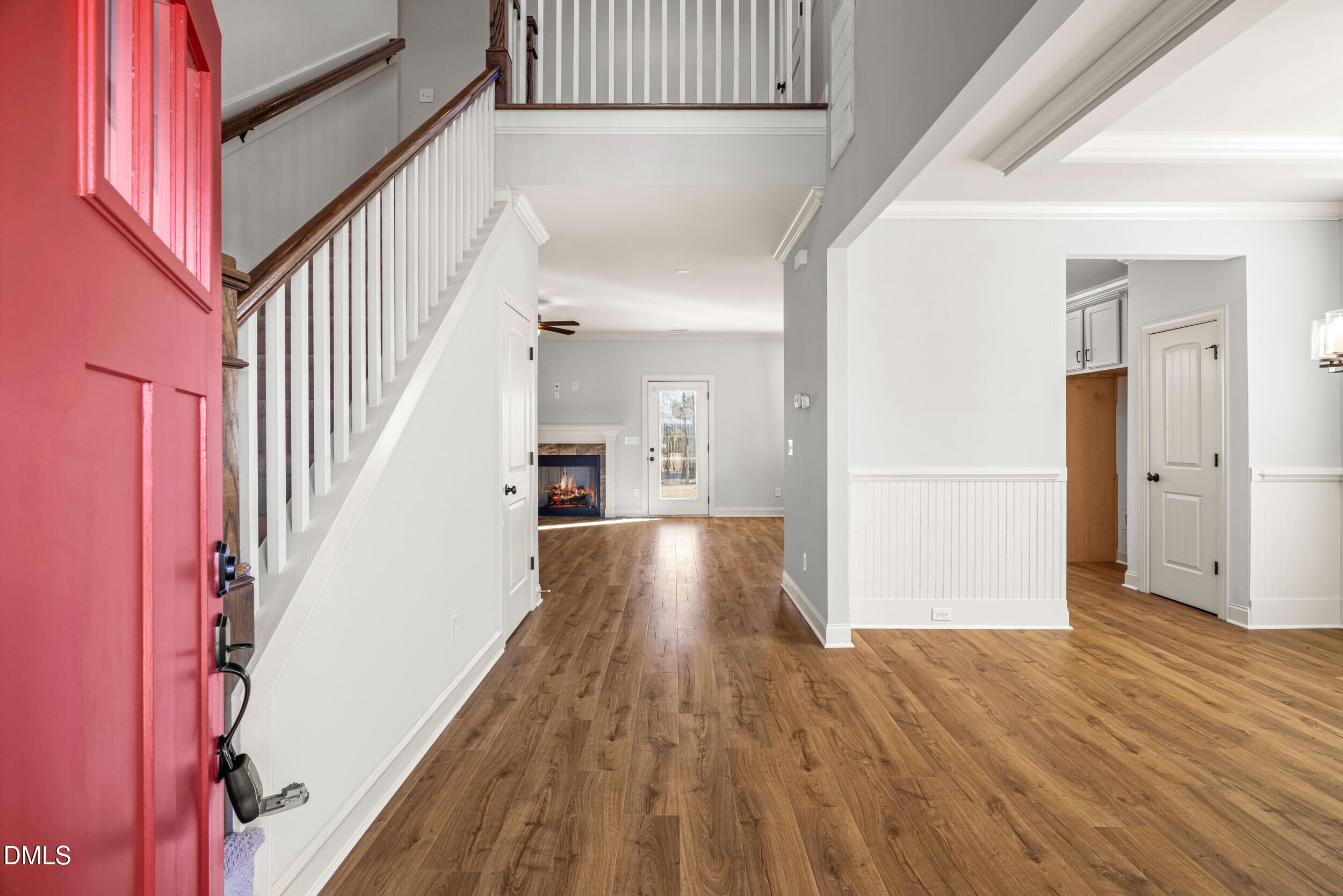 86 Sharpstone Lane Clayton, NC 27527 - Photo 3 of 36 a view of gallery with wooden floor and stairs