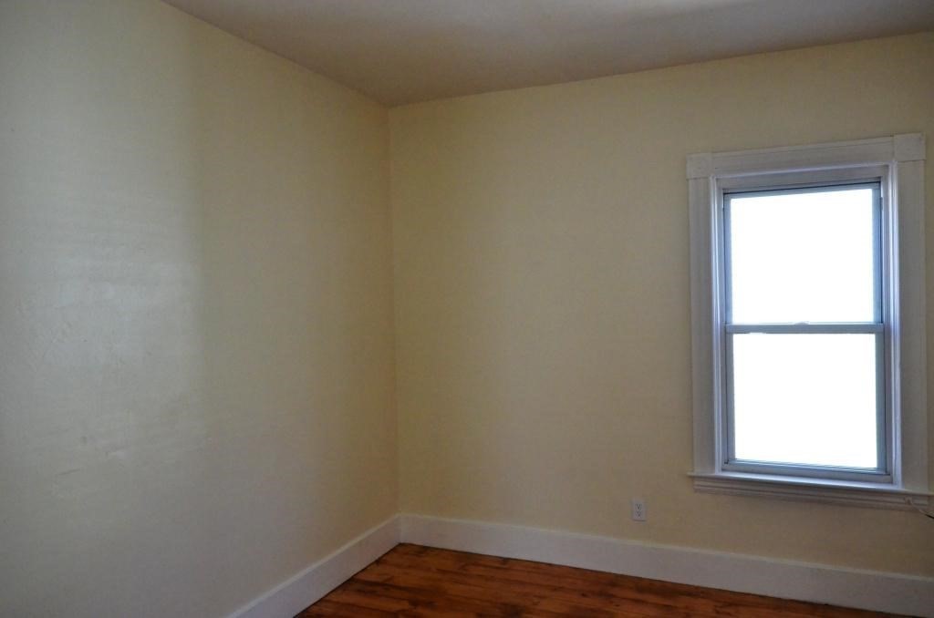 71 Esther Street, Unit 2 Worcester, MA 01607 - Photo 14 of 19 a view of a small space with wooden floor and a window
