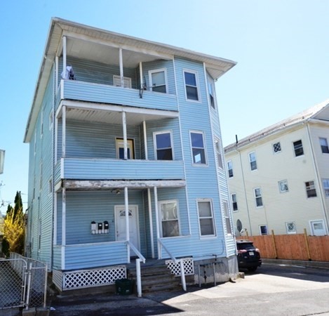 71 Esther Street, Unit 2 Worcester, MA 01607 - Photo 19 of 19 a front view of a house with a yard