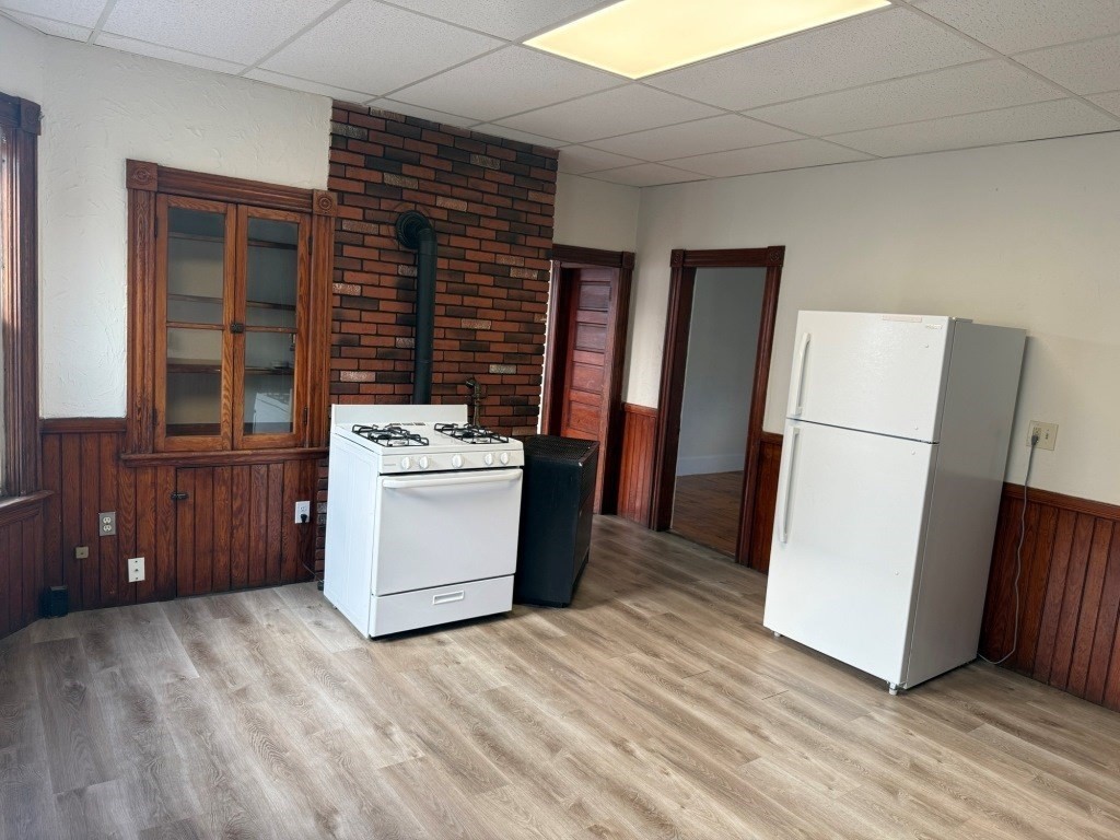 71 Esther Street, Unit 2 Worcester, MA 01607 - Photo 2 of 19 a kitchen with a white stove top oven and refrigerator
