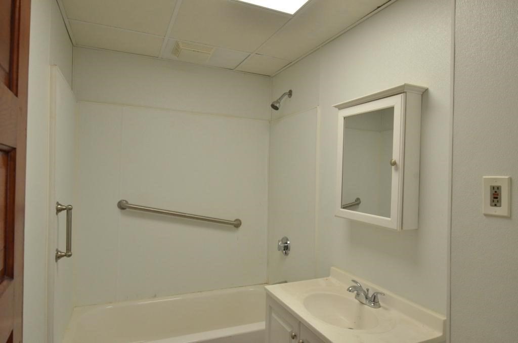 71 Esther Street, Unit 2 Worcester, MA 01607 - Photo 9 of 19 a bathroom with a sink and shower