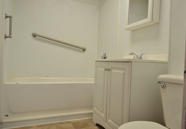 71 Esther Street, Unit 2 Worcester, MA 01607 - Photo 10 of 19 a bathroom with a shower and a toilet