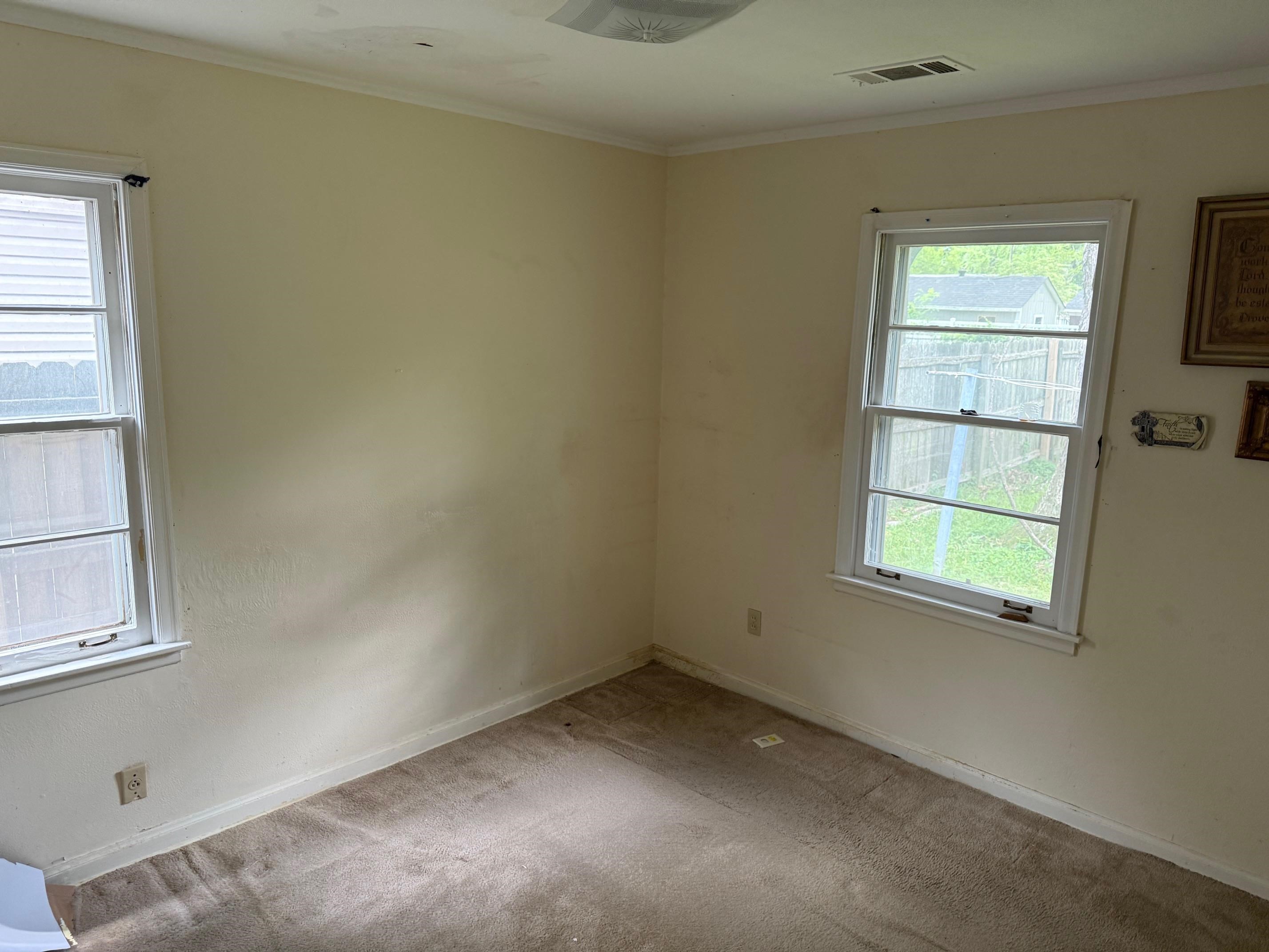 4519 Quince Road Memphis, TN 38117 - Photo 3 of 7 Unfurnished room with carpet, baseboards, and crown molding