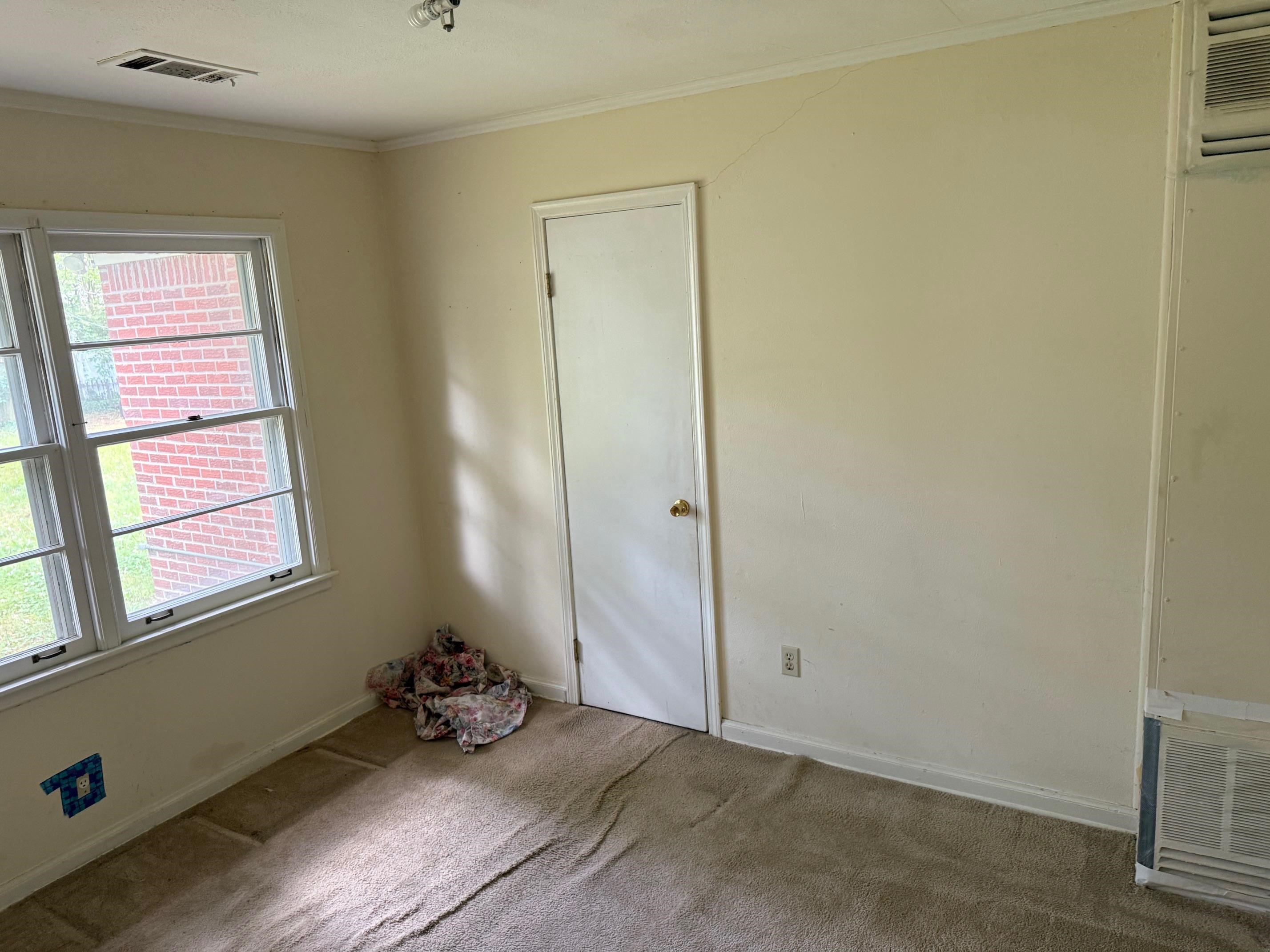4519 Quince Road Memphis, TN 38117 - Photo 5 of 7 Empty room with carpet floors, ornamental molding, and baseboards
