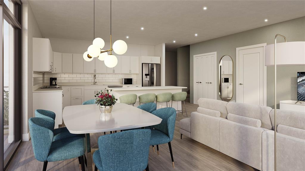 3101 Old Archer Road, Unit 405 Gainesville, FL 32608 - Photo 7 of 18 a view of a dining room with furniture and a chandelier