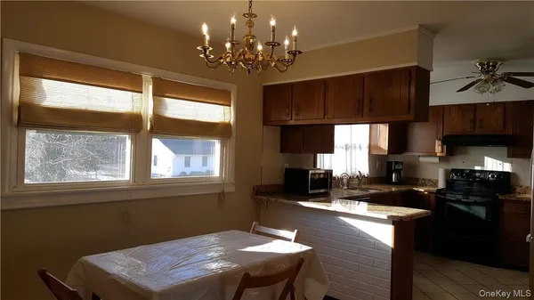 a bathroom with a toilet and a shower curtain