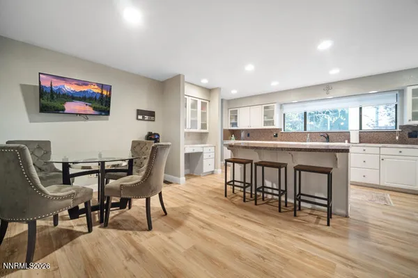 a bathroom with a double vanity sink and mirror