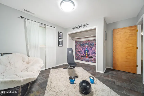 a view of balcony with wooden floor and fence