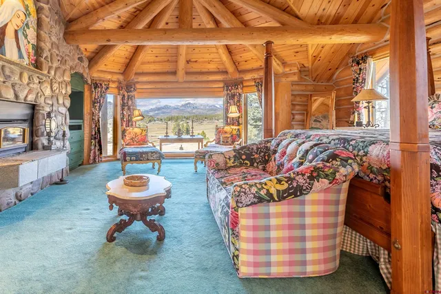 a living room with furniture and a toilet