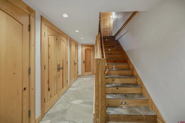 a view of a hallway with staircase