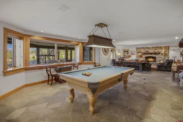 a living room with furniture a window and a table