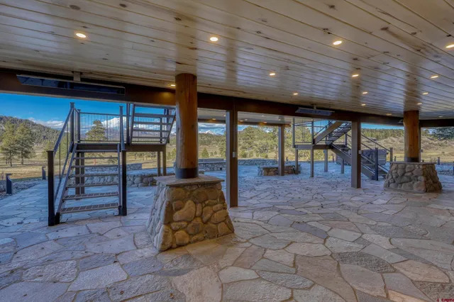 a view of swimming pool with sitting area