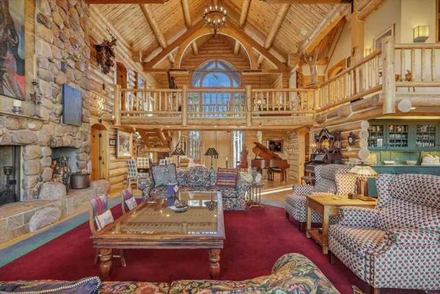 a living room with lots of furniture and a rug