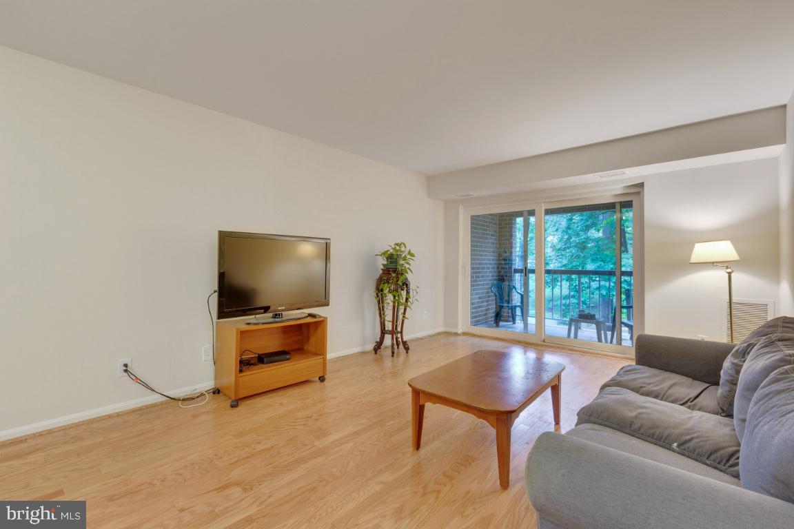 5837 Cove Landing Road, Unit 203 Burke, VA 22015 - Photo 5 of 25 Living room with access to balcony