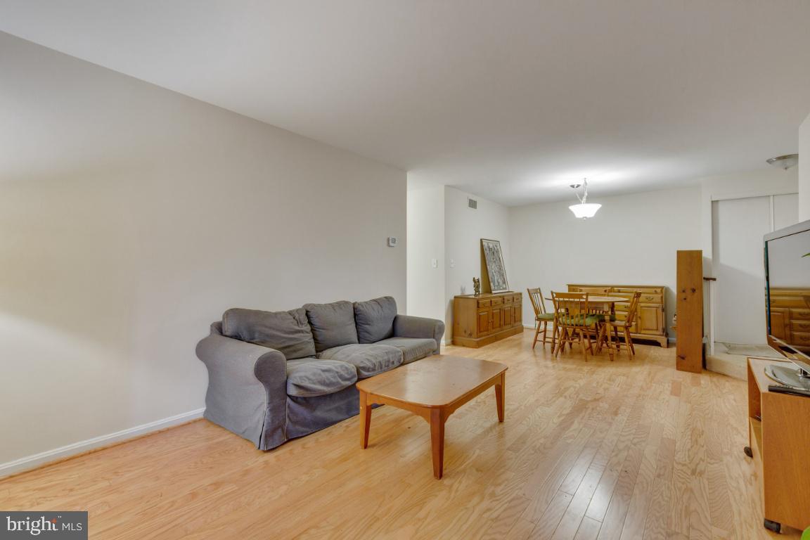 5837 Cove Landing Road, Unit 203 Burke, VA 22015 - Photo 6 of 25 Living room and dining room