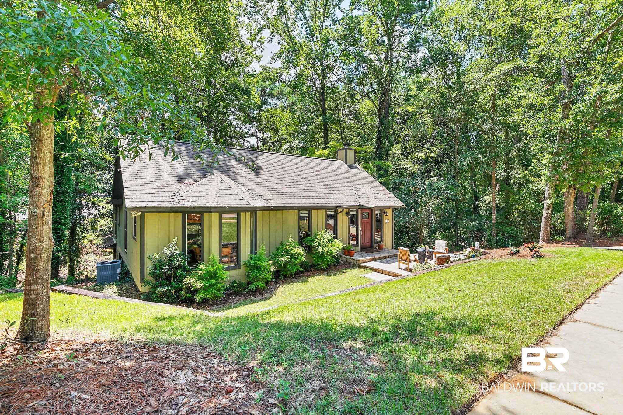 332 Ridgewood Drive Daphne, AL 36526 - Photo 9 of 48 View of front of property with a shingled roof, a front lawn, and a chimney