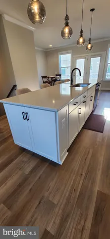 a view of a living room with furniture and a flat screen tv