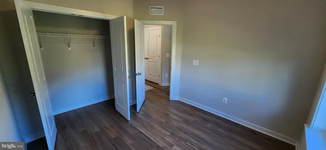 a bathroom with double vanity sink and mirror