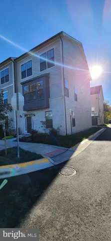 a view of entryway with wooden floor and windows