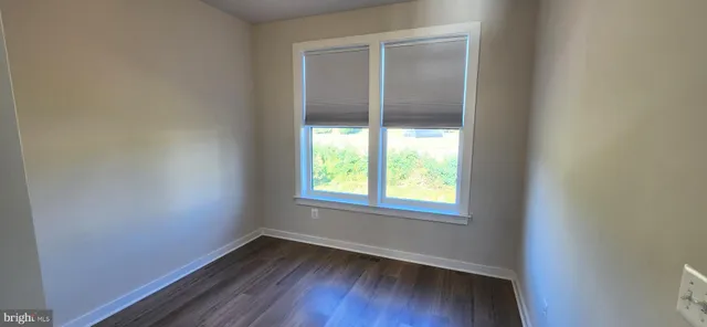 a bathroom with a shower and a sink