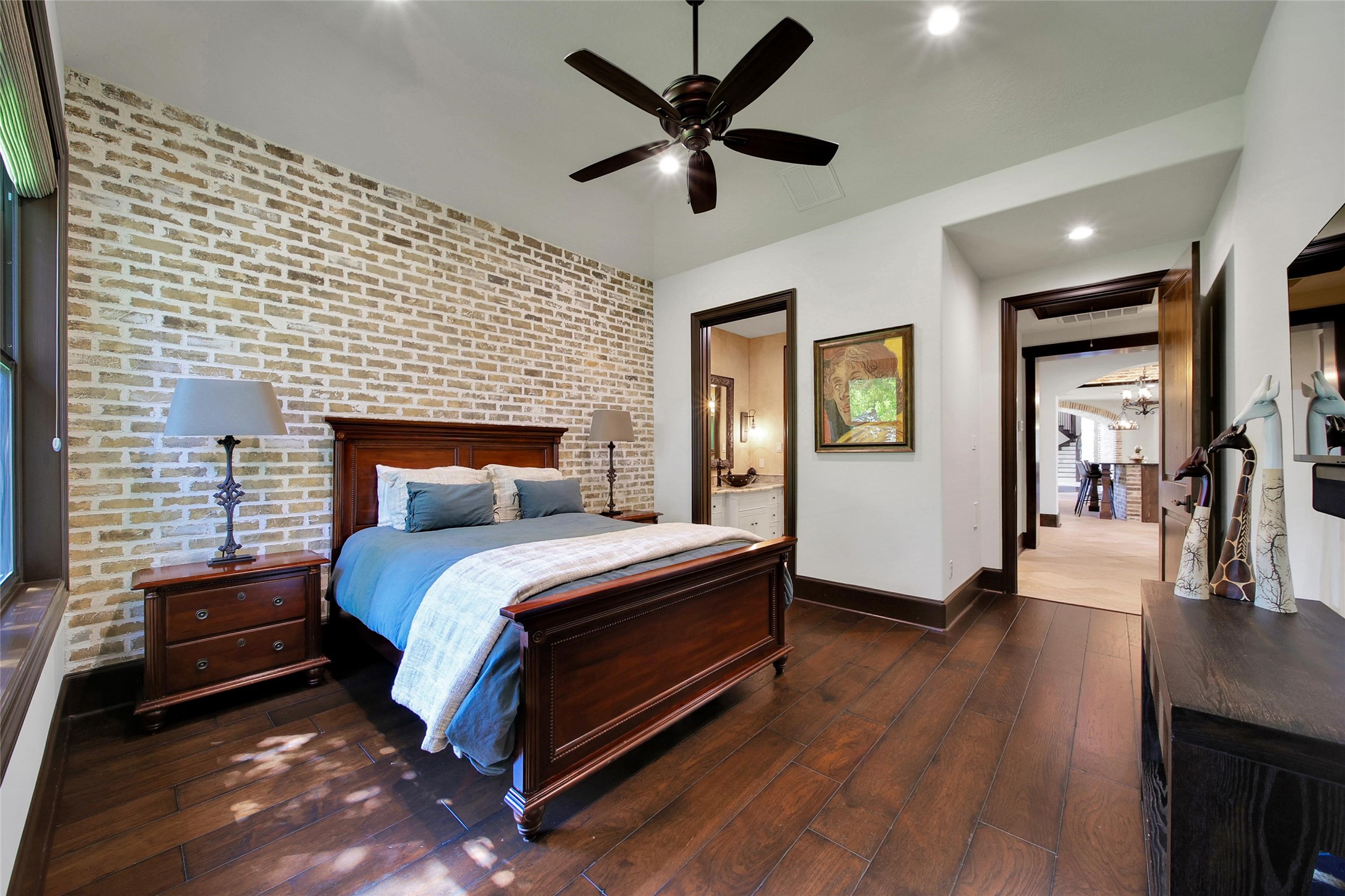 2 Highclere Park Drive Spring, TX 77379 - Photo 16 of 50 This first-floor guest suite offers privacy and convenience, featuring its own sink and walk-in shower while thoughtfully connecting to a half bath that can also serve guests when entertaining.