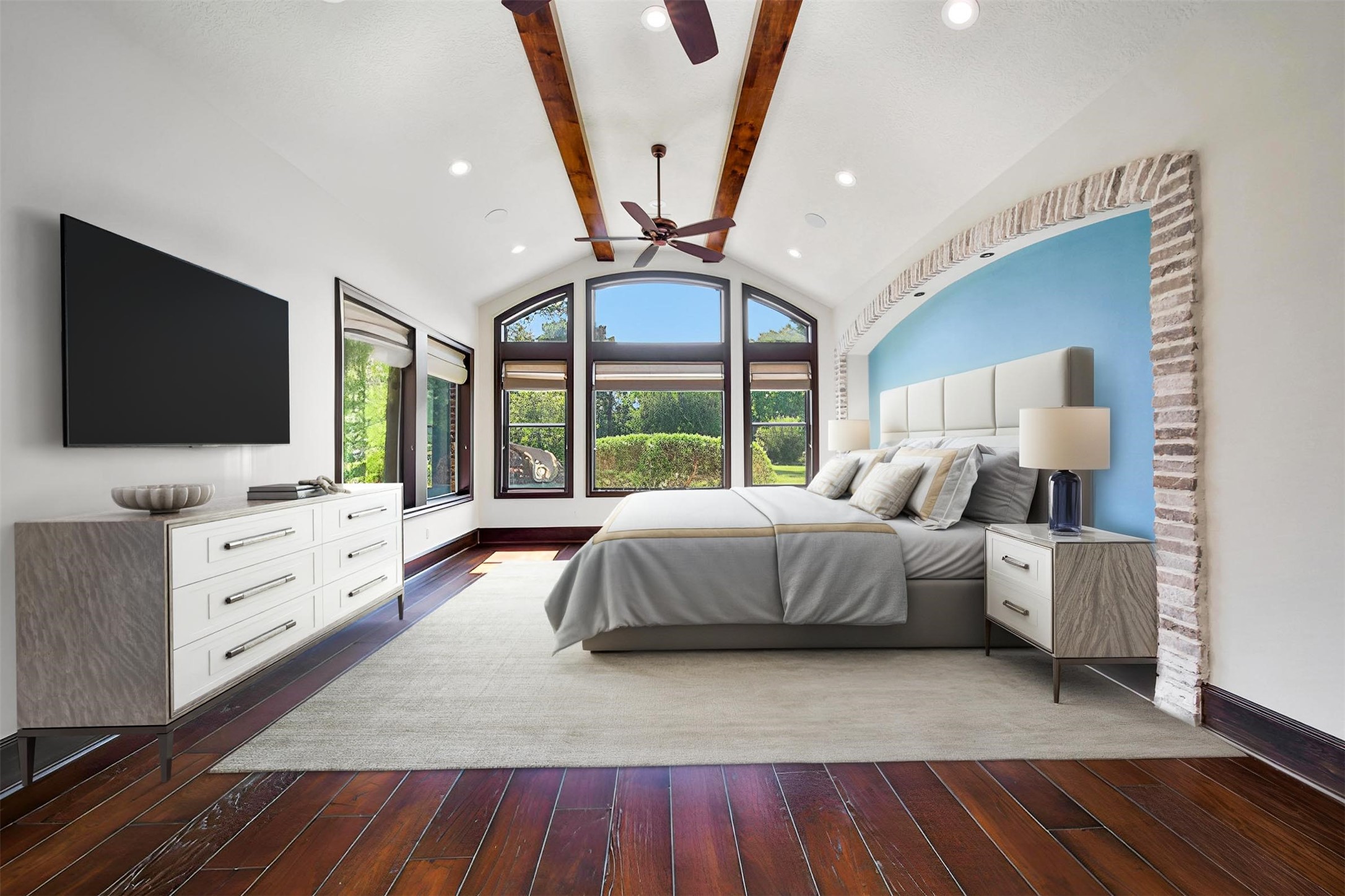 2 Highclere Park Drive Spring, TX 77379 - Photo 18 of 50 Secluded in its own private wing, the owner’s suite is perfect for unwinding. This beautifully appointed bedroom offers serene views of the backyard oasis, blending comfort and tranquility. (Virtually staged)