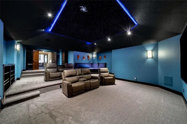 a view of a bedroom with furniture and a window