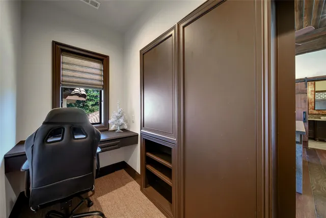 a bathroom with a granite countertop sink vanity and mirror