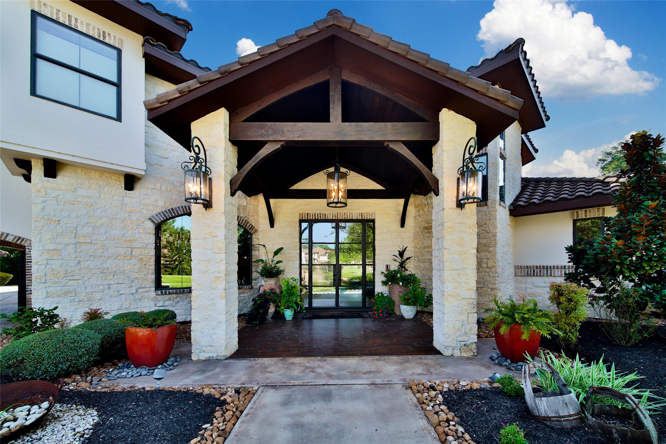 2 Highclere Park Drive Spring, TX 77379 - Photo 3 of 50 Welcome inside the 8,116 sf home with 5 bedrooms, 4.2 baths, 2 first floor living areas, a study nook, gameroom, media room, and 2 laundry rooms.