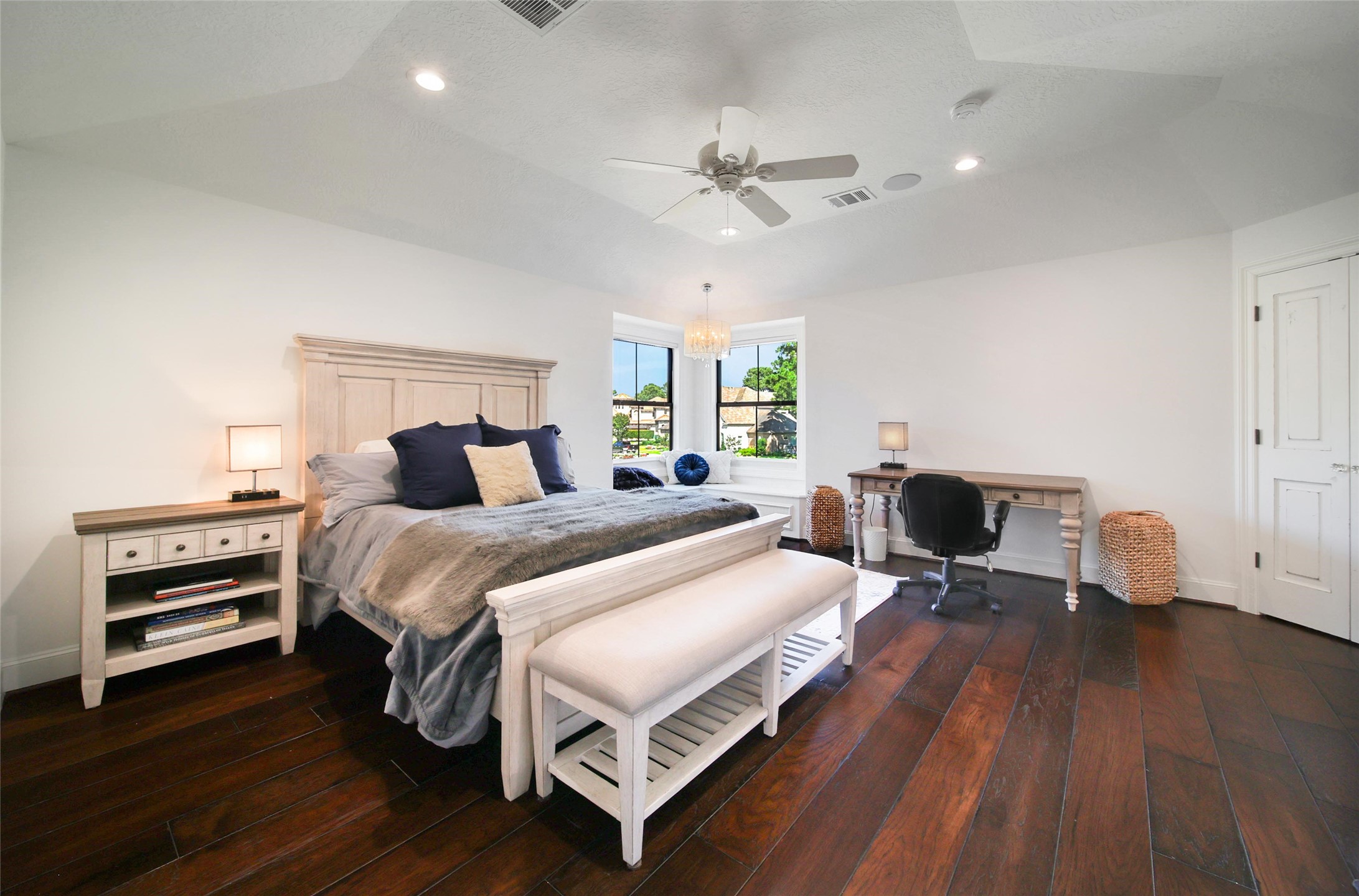 2 Highclere Park Drive Spring, TX 77379 - Photo 31 of 50 The 3rd upstairs bedroom is light and bright with a charming corner bench seat under the windows and a large closet with custom built-ins.