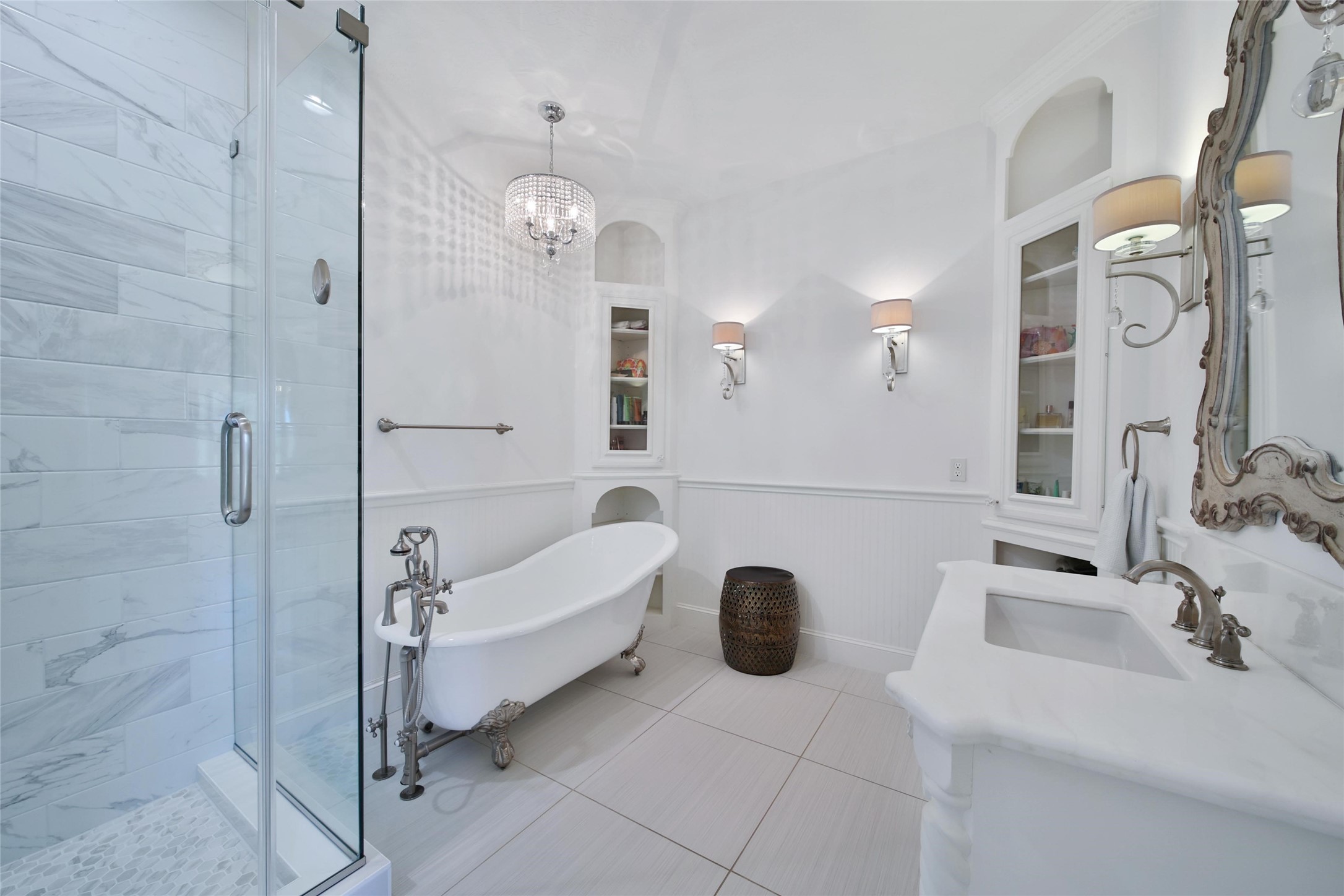 2 Highclere Park Drive Spring, TX 77379 - Photo 32 of 50 This recently remodeled private en-suite is gorgeous with a free standing tub, glass shower, and corner storage cabinets.