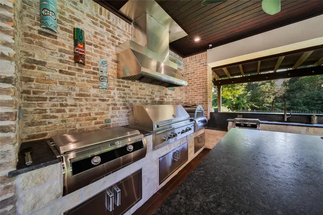 a kitchen with stove and cabinets