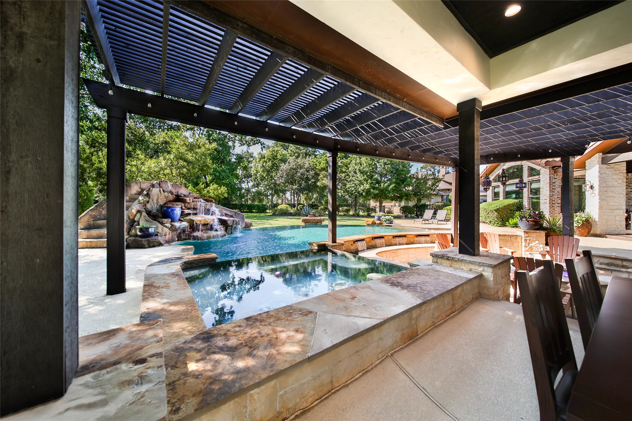 2 Highclere Park Drive Spring, TX 77379 - Photo 41 of 50 This large spa, shaded by a sleek pergola, provides a peaceful retreat overlooking the pool and waterfall.