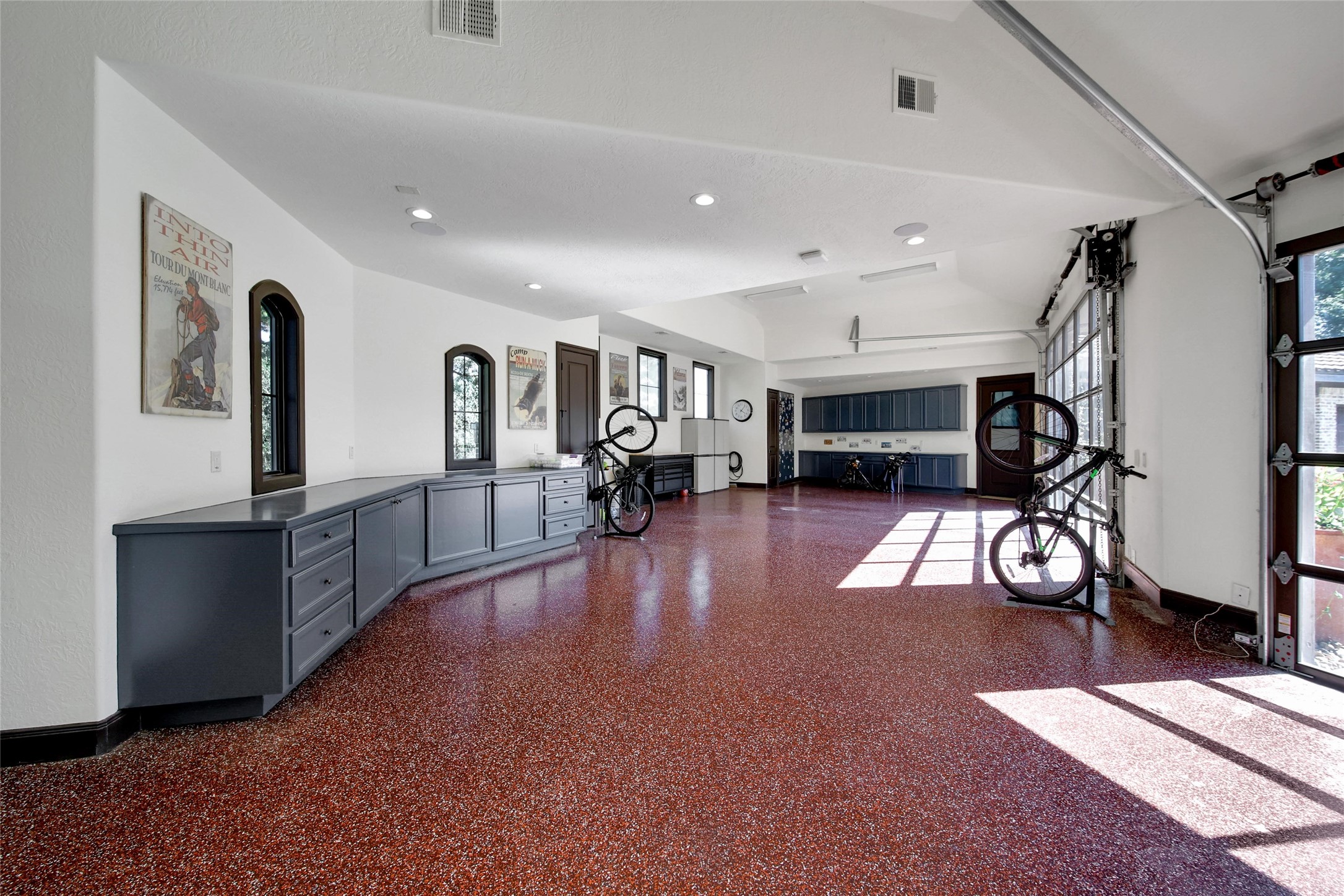 2 Highclere Park Drive Spring, TX 77379 - Photo 46 of 50 This oversized three-bay garage features air conditioning, built-in cabinetry, workshop area, and a spacious double-wide bay with clearance for a car lift. There's great storage, space for workout equipment and surround sound, plus a convenient half bath.
