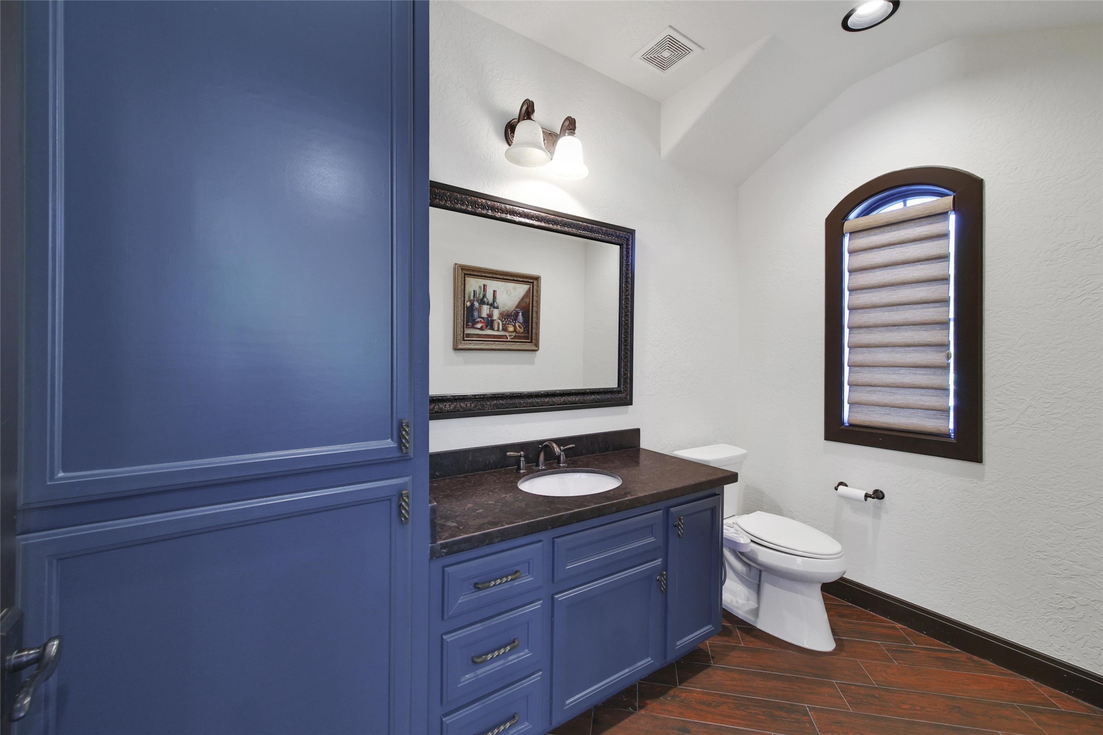 2 Highclere Park Drive Spring, TX 77379 - Photo 47 of 50 The half bath is the perfect convenience whether you use this space for a workshop or a home gym.