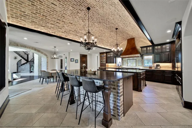 a dinning area with lots of tables a glass table and chairs